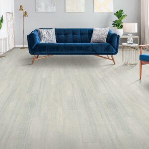 Blue couch on laminate floor | Carpet House Flooring Center