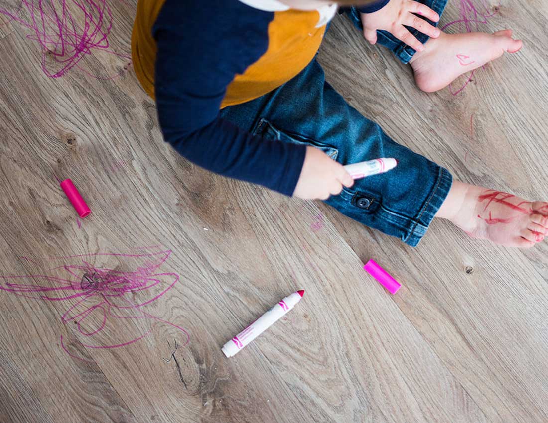 Baby draws on floor | Carpet House Flooring Center